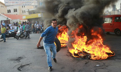 Tire burning threatens Lebanon's public health and economy