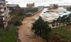 As the storm continues, roads turn to lakes, trees fall, walls collapse 